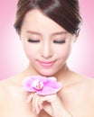 Beautiful face with pink orchids Royalty Free Stock Photo