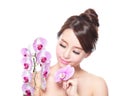 Beautiful face with pink orchids Royalty Free Stock Photo