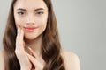 Beautiful face. Pretty woman with clear skin and manicured nails with white nail polish closeup portrait