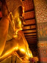 Beautiful face of Reclining Buddha, and thai art architecture in Wat Phra Chetupon Vimolmangklararm Wat Pho temple They are