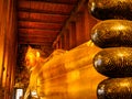 Beautiful face of Reclining Buddha, and thai art architecture in Wat Phra Chetupon Vimolmangklararm Wat Pho temple They are