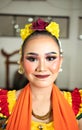 beautiful face of a traditional Indonesian dancer wearing flowers and charming makeup before performing Royalty Free Stock Photo