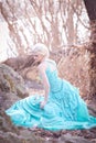 Beautiful fairy in a long turquoise dress Royalty Free Stock Photo