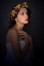 Beautiful Fairy, Nymph, Dark Hair Woman wearing a floral colorful wreath