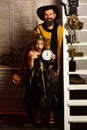 Beautiful fairy and wizard. Father and child celebrate halloween. Treat me like a fairy. Father and child have fun