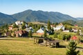 Beautiful fairytale landscape of Tihuta pass Village in North Romania during sunny autumn day