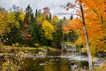 Beautiful Fall Colors along a Mountain River on a Cloudy Day Royalty Free Stock Photo