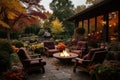 Beautiful fall garden, residential backyard with outdoor chairs and fire-pit with flame, cozy autumn lanscape design