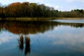 Marsh waters reflecting sky and fall colors Royalty Free Stock Photo