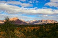 Beautiful Fall Sunset in Southern Utah Canyon Country. Multi-colored sandstone rock formations in the foreground Royalty Free Stock Photo