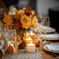 Beautiful fall table setting, autumn dinner table decoration with flowers and candles, holiday event decor in orange and