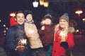 Beautiful family with burning sparklers