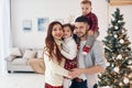 Beautiful family celebrates New year and christmas indoors at home