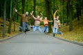 Family of four jumping in autumn park Royalty Free Stock Photo