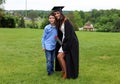 Beautiful siblins and girl in black Cap, Gown and Tass, teenager. Unique gorgeous face, nice smile, wonderful eyes girl.