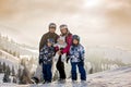 Beautiful family with kids, skiing in a scenery area in Austrian