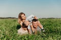 Beautiful family playing and having a picnic in field