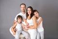 Beautiful family portrait, father, mother and three boys, looking happily at camera Royalty Free Stock Photo
