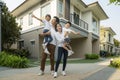 Beautiful family portrait smiling outside their new house with sunset Royalty Free Stock Photo