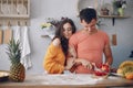 Beautiful family prepare food in a kitchen