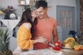 Beautiful family prepare food in a kitchen