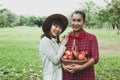 Beautiful family woman smile holding and eating apples at park. Royalty Free Stock Photo