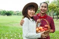 Beautiful family woman smile holding and eating apples at park. Royalty Free Stock Photo