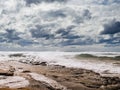 Beautiful Fanore beach, Yellow sand, blue water and cloudy sky, Waves rushing towards the coast, County Clare, Ireland