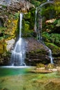 Beautiful fantasy-like waterfall with emerald green water Royalty Free Stock Photo