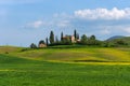 Beautiful farmland rural landscape, cypress trees and colorful spring flowers in Tuscany, Italy. Typical rural house Royalty Free Stock Photo