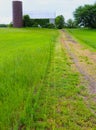 Rural Pathway Leads Straight to Abandoned Barn and Silo Royalty Free Stock Photo