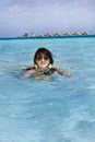 Beautiful fashion asian girl swim in ocean Royalty Free Stock Photo