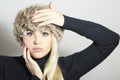 Beautiful Fashion Blond Woman in Fur. Beauty Girl. Winter Style. Red Manicure. Make-up Royalty Free Stock Photo