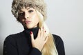 Beautiful Fashion Blond Woman in Fur. Beauty Girl. Winter Style. Red Manicure. Make-up Royalty Free Stock Photo