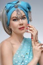 Beautiful fashion east woman portrait with oriental accessories Royalty Free Stock Photo