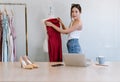 Beautiful Fashion Female small business owner, Entrepreneur. Young Asian woman stylish fashion designer taking measurements on Royalty Free Stock Photo