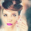 Beautiful Fashion Girl Face with Fancy Hairstyle, Colorful Nail Polish Royalty Free Stock Photo