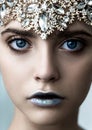 Beautiful fashion model with bright makeup and blue silver lips with jewelery diamond crown Royalty Free Stock Photo