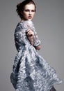 Beautiful fashion model wearing blue silk dress Royalty Free Stock Photo