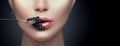 Beautiful fashion model woman eating black caviar. Beauty girl with caviar on her lips