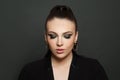 Beautiful fashion model woman face with dark green smokey eyes makeup closeup portrait Royalty Free Stock Photo