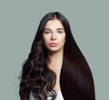 Beautiful fashion model woman with long straight hair and perfect curly hairstyle on blue background
