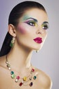 Beautiful fashion portrait of young woman with bright colorful makeup