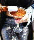 Beautiful fashion woman drink gold glitter martini cosmopolitan cocktail Royalty Free Stock Photo