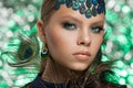 Beautiful fashion woman face. Perfect blue green makeup.