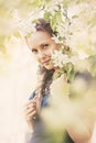 Beautiful fashion woman in a spring blooming garden Royalty Free Stock Photo