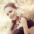 Beautiful fashion woman in a spring garden Royalty Free Stock Photo
