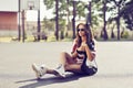 Beautiful and fashion young woman posing with guitar Royalty Free Stock Photo