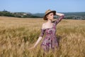 Beautiful fashionable blonde woman in a field of yellow ripe wheat Royalty Free Stock Photo