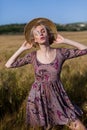 Beautiful fashionable blonde woman in a field of yellow ripe wheat Royalty Free Stock Photo